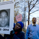 Tomiko Shine holds up a picture of Tamir Rice, the 12-year-old boy fatally shot on Nov. 22 by a rookie police officer, during a protest in Ferguson, Mo.